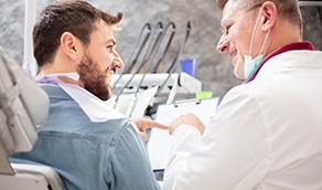 Patient in Torrance talking to dentist about dental implants