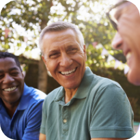 Group of men laughing together outdoors