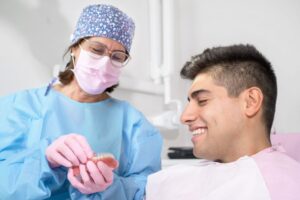 Dentist and patient talking about Invisalign